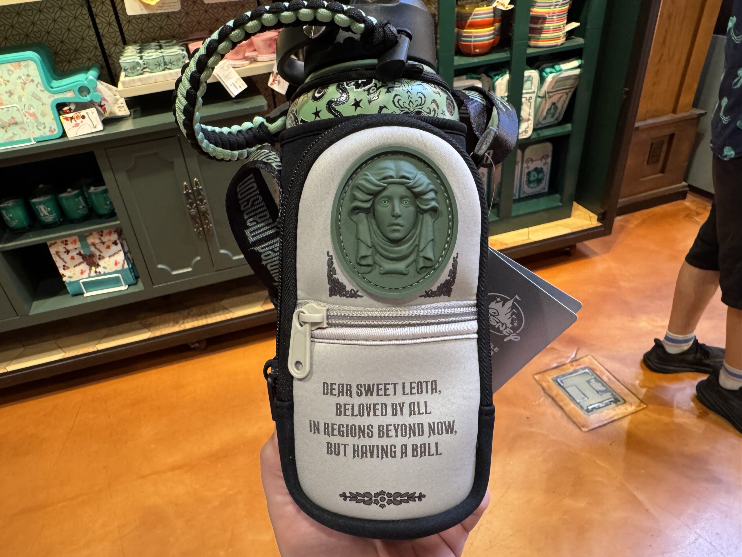 Carry Around Madame Leota's Tombstone with this New Haunted Mansion Sling Bottle at Walt Disney World